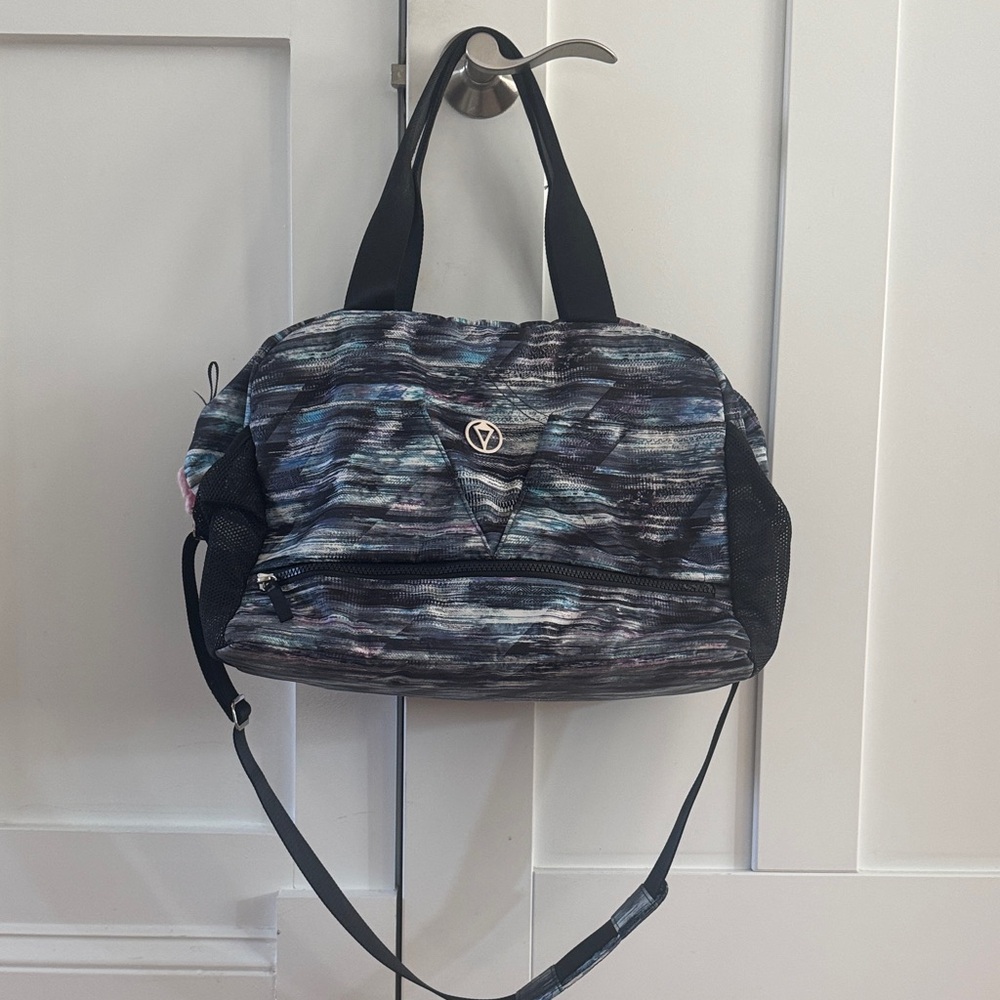 Used- Colorful Striped Duffel Bag with Black Handles
